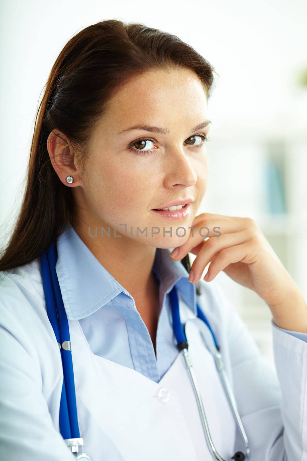 Portrait of confident female doctor looking at camera in hospital