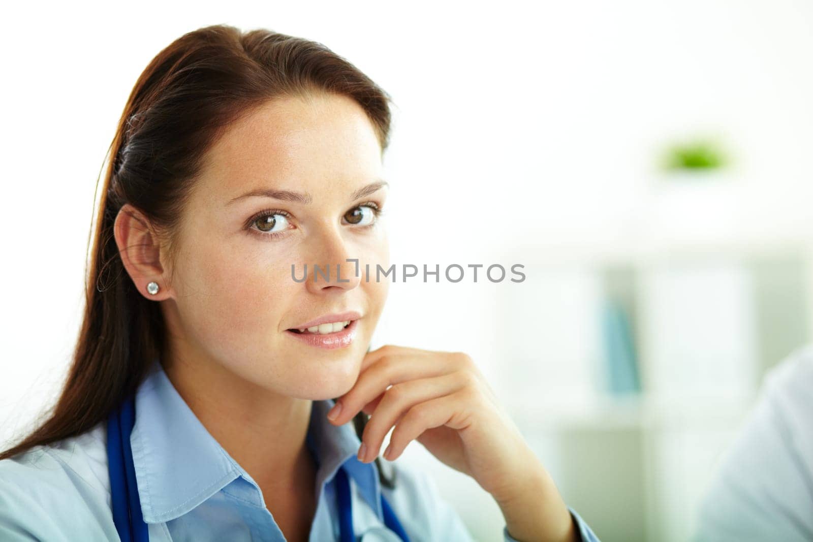 Portrait of confident female doctor looking at camera in hospital
