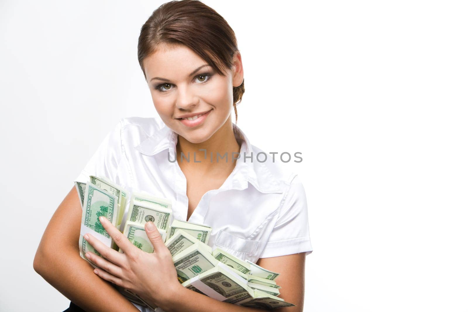 Portrait of charming woman holding dollars and looking at camera with smile