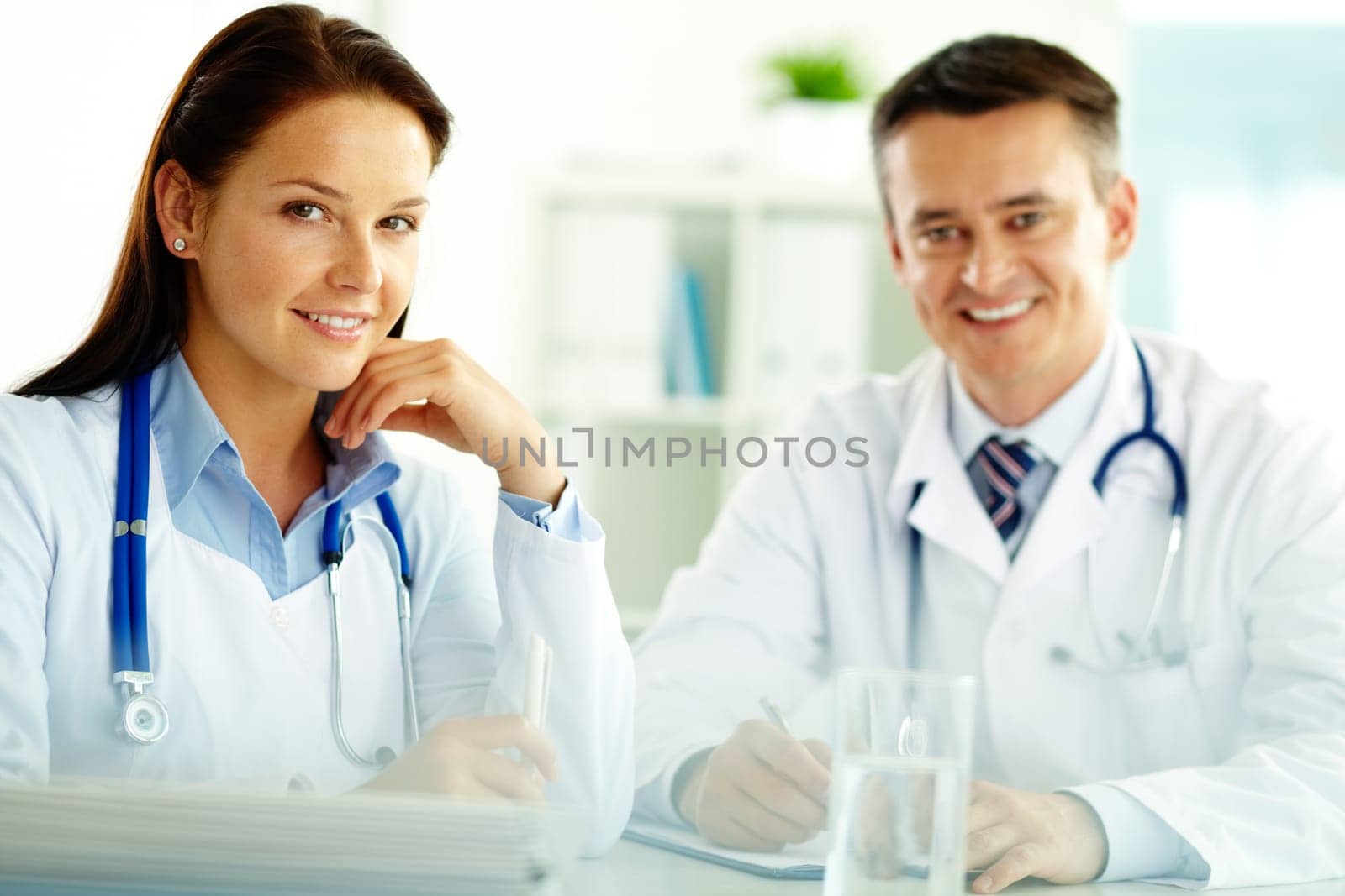 Portrait of confident doctors looking at camera in hospital