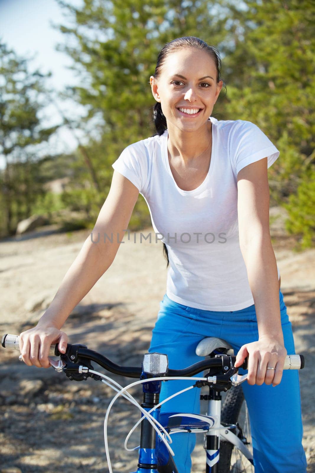 Portrait of a pretty woman on bicycle