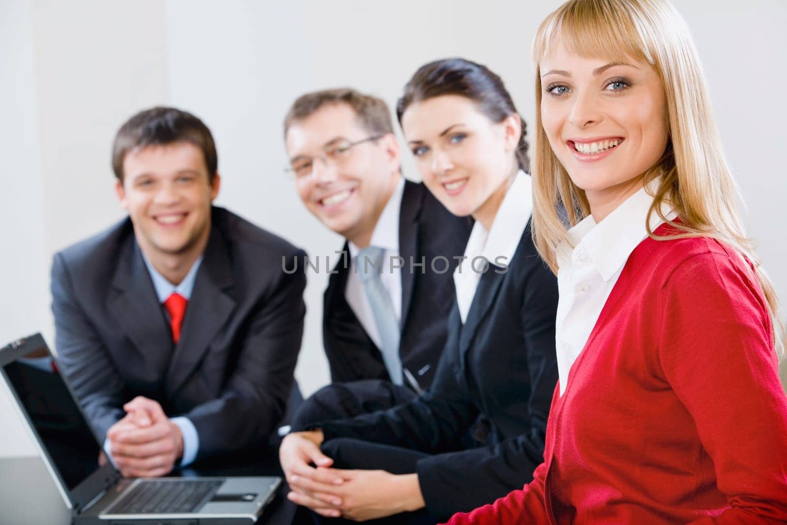Portrait of successful specialists gathered together for discussion of new strategy