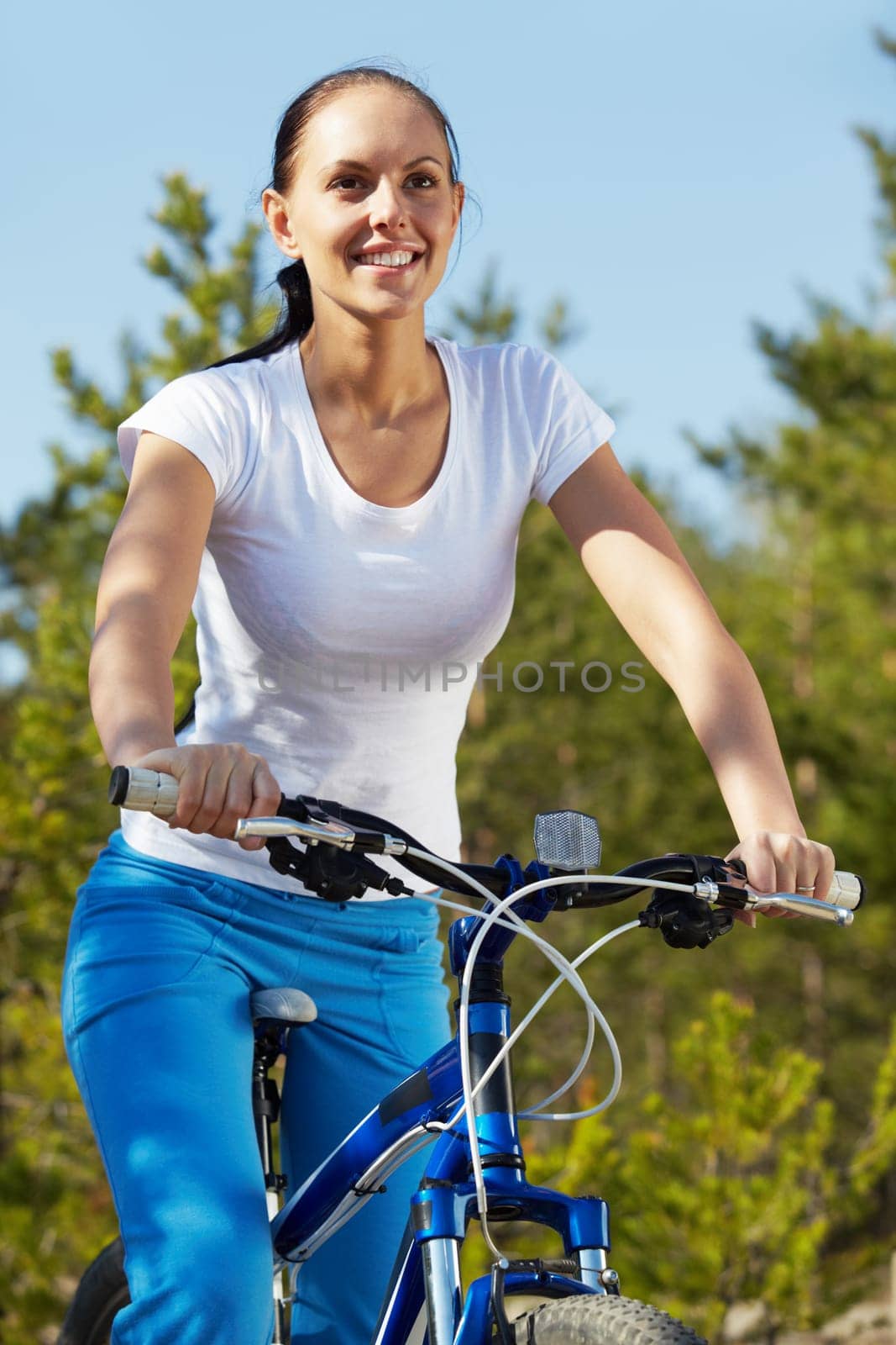 Pretty young woman riding a bicycle