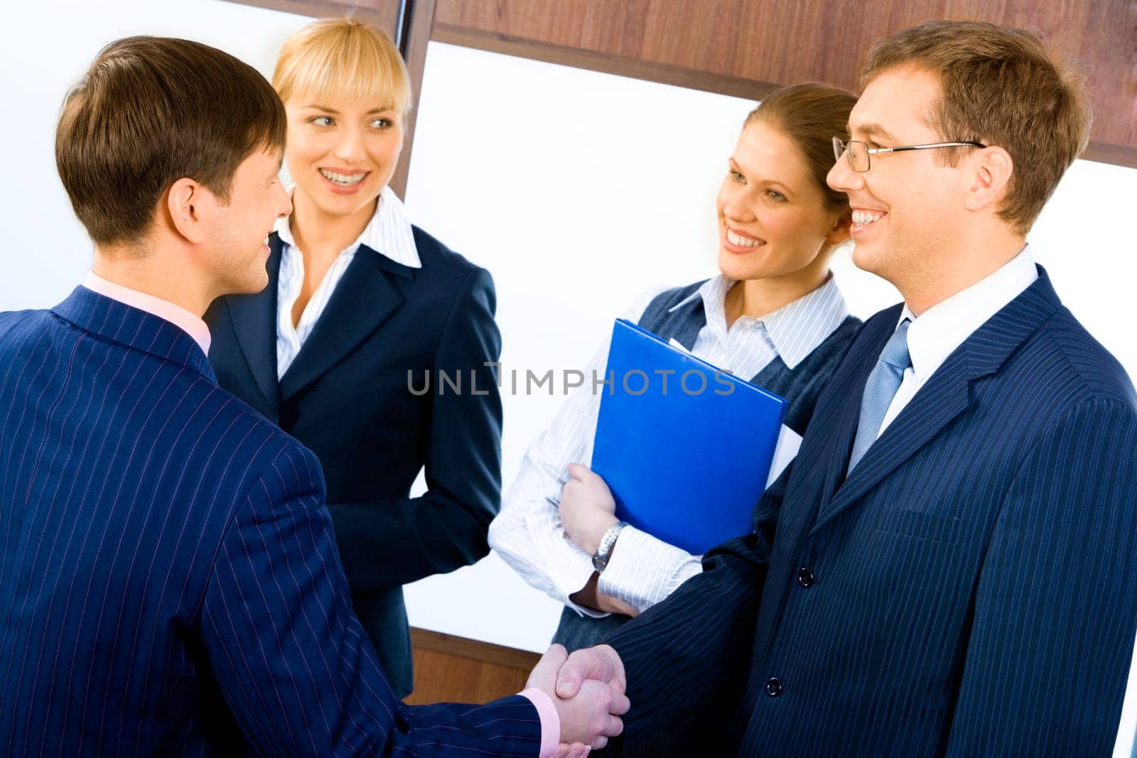 Business people shaking hands making an agreement at meeting