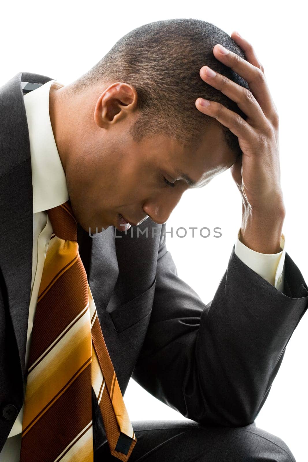 Photo of businessman sitting in pose of thinker on white background