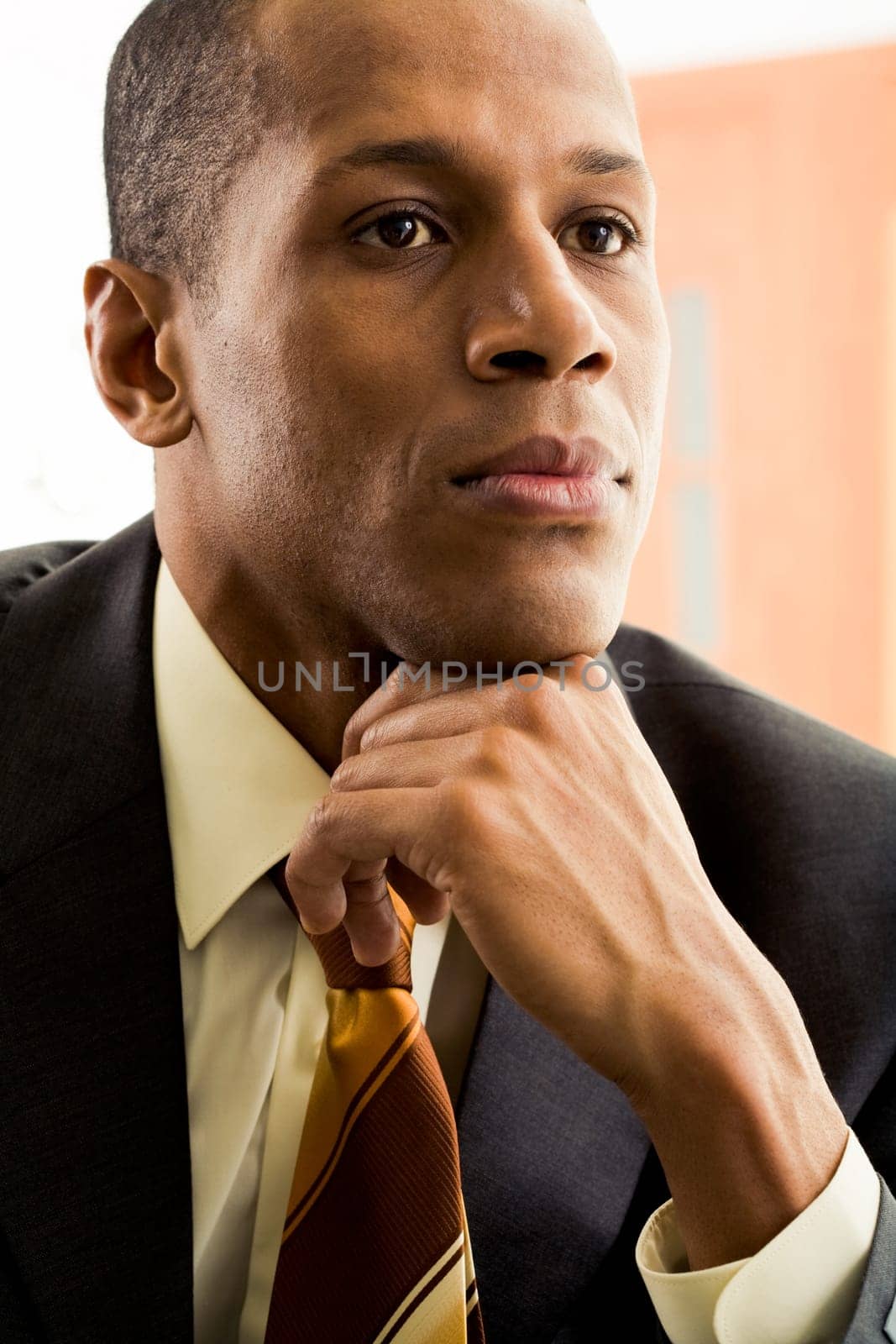 Portrait of thoughtful businessman thinking during work