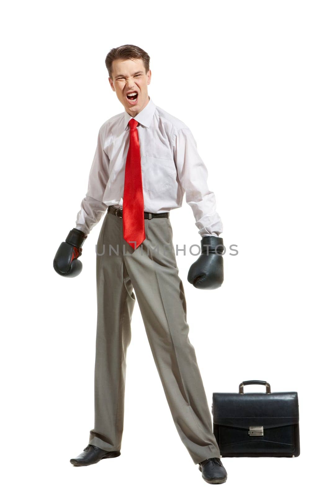 Portrait of aggressive businessman in boxing gloves over white background