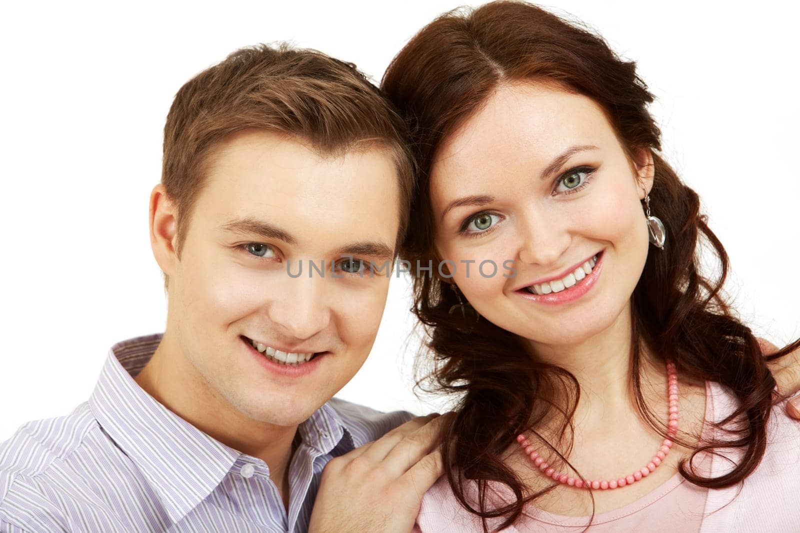 Portrait of a young beautiful couple looking at camera and smiling