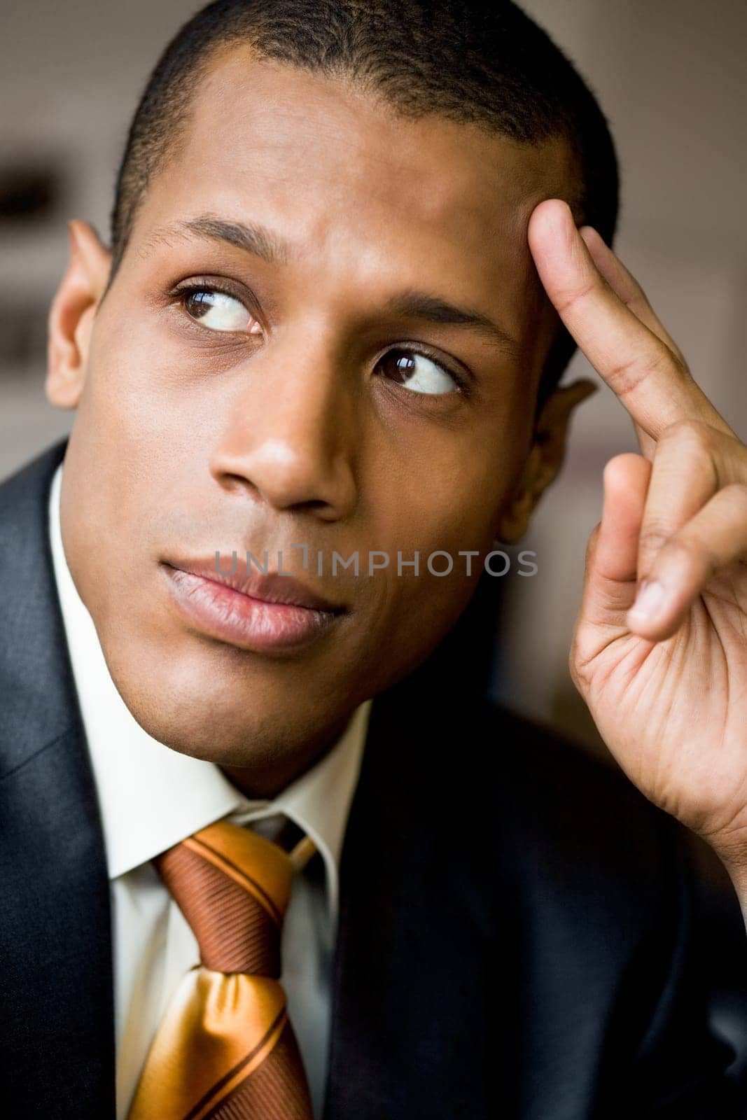 Pensive employee thinking of new ideas and looking aside
