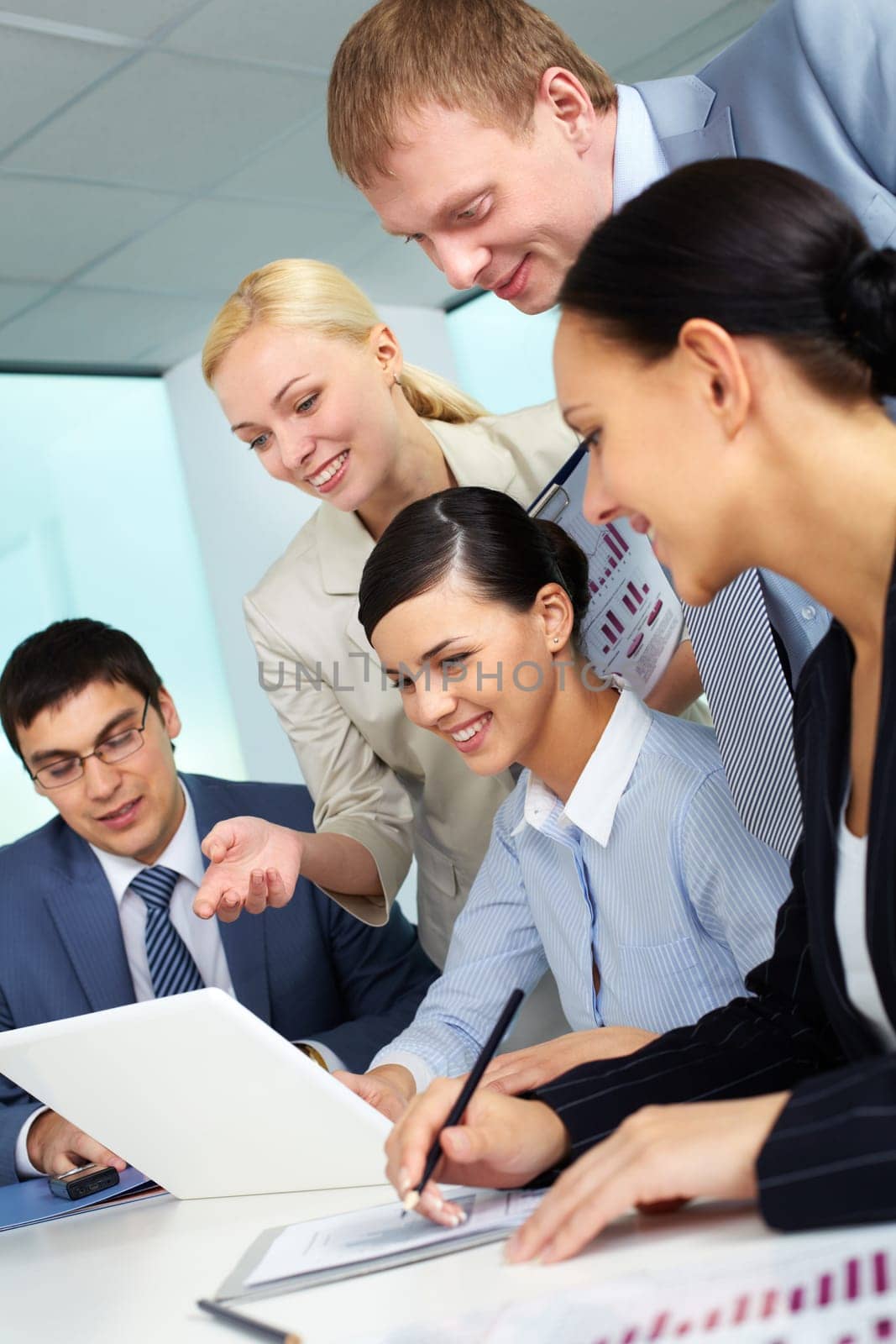 Business team looking at laptop screen
