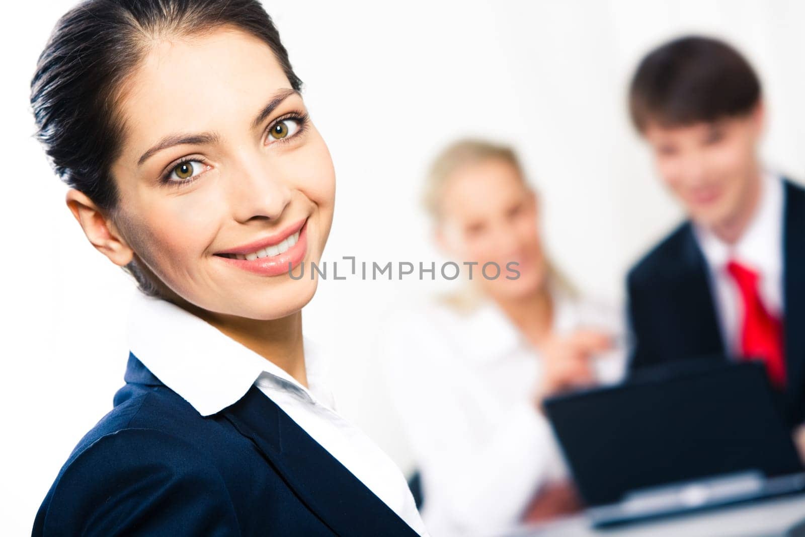 Close-up of happy woman looking at camera in working environment