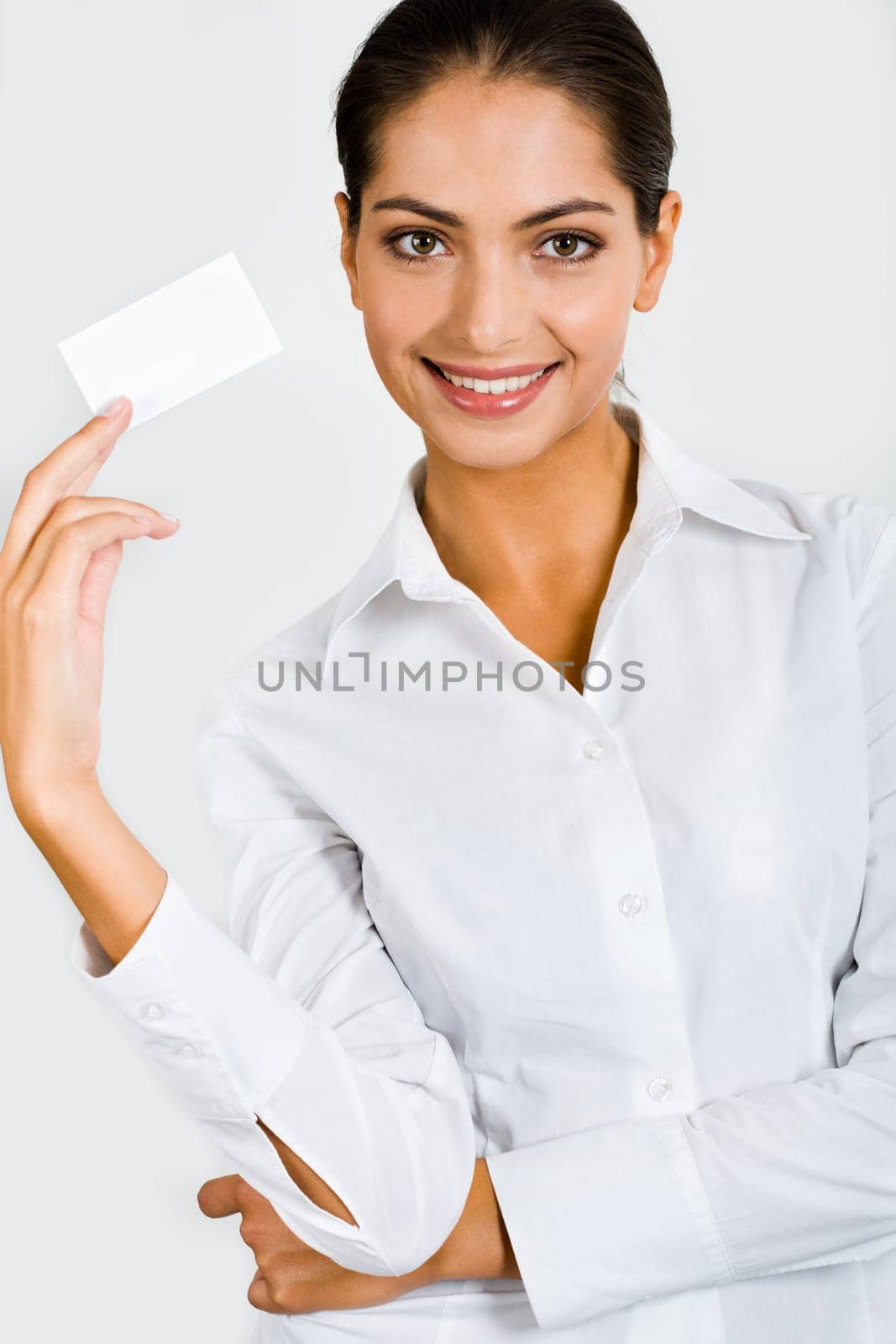 Representative person in the white clothing is holding the business card