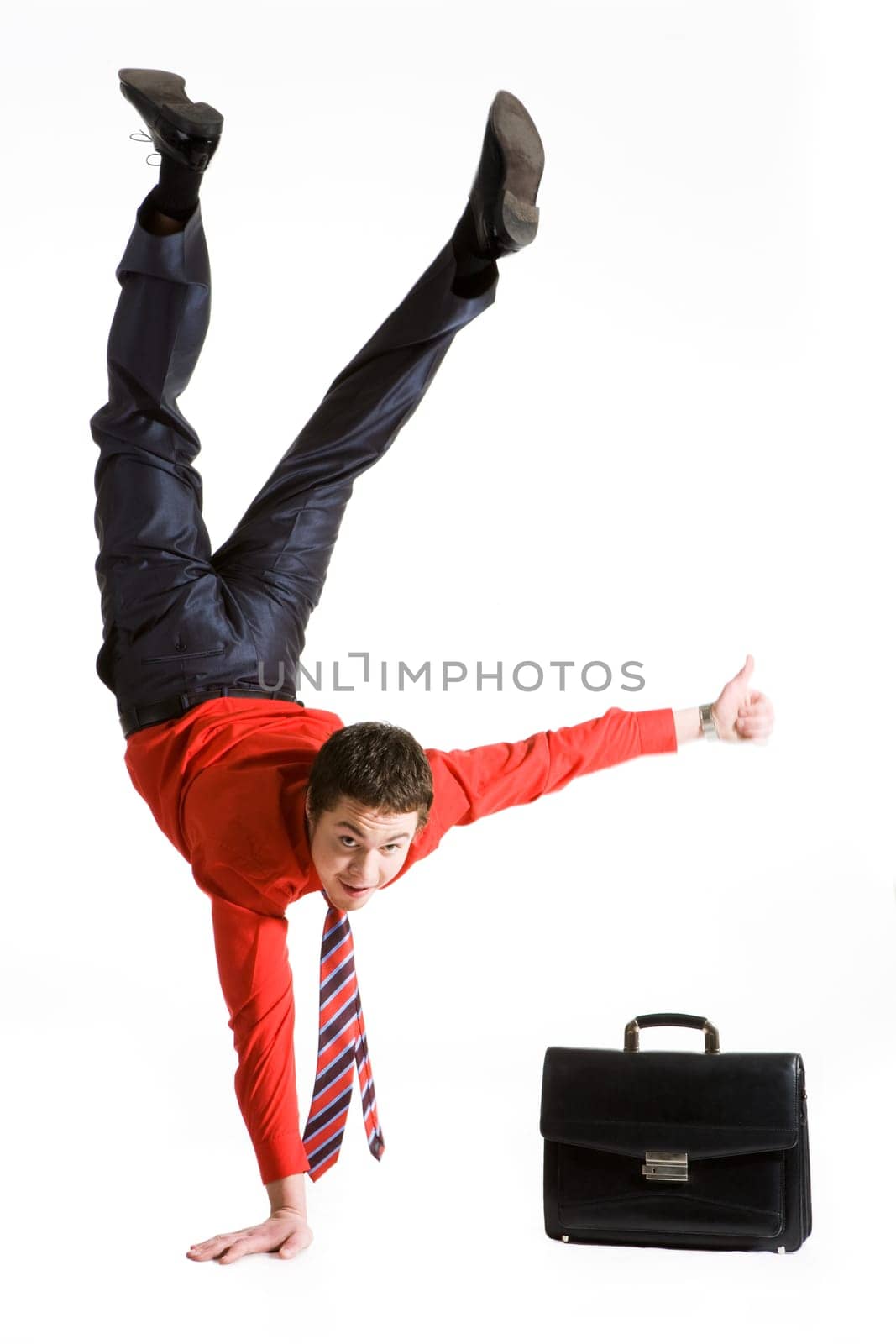 Photo of isolated young man showing sign of okay while keeping on right arm