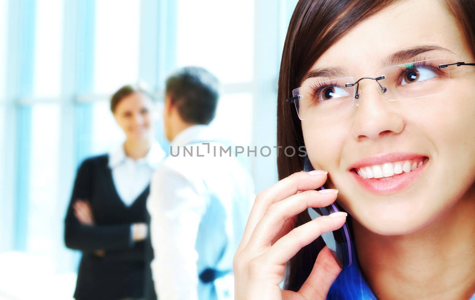 Photo of smart businesswoman calling with interacting people behind