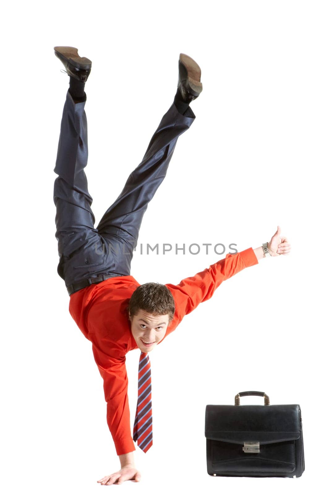 Photo of isolated young man showing sign of okay while keeping on right arm