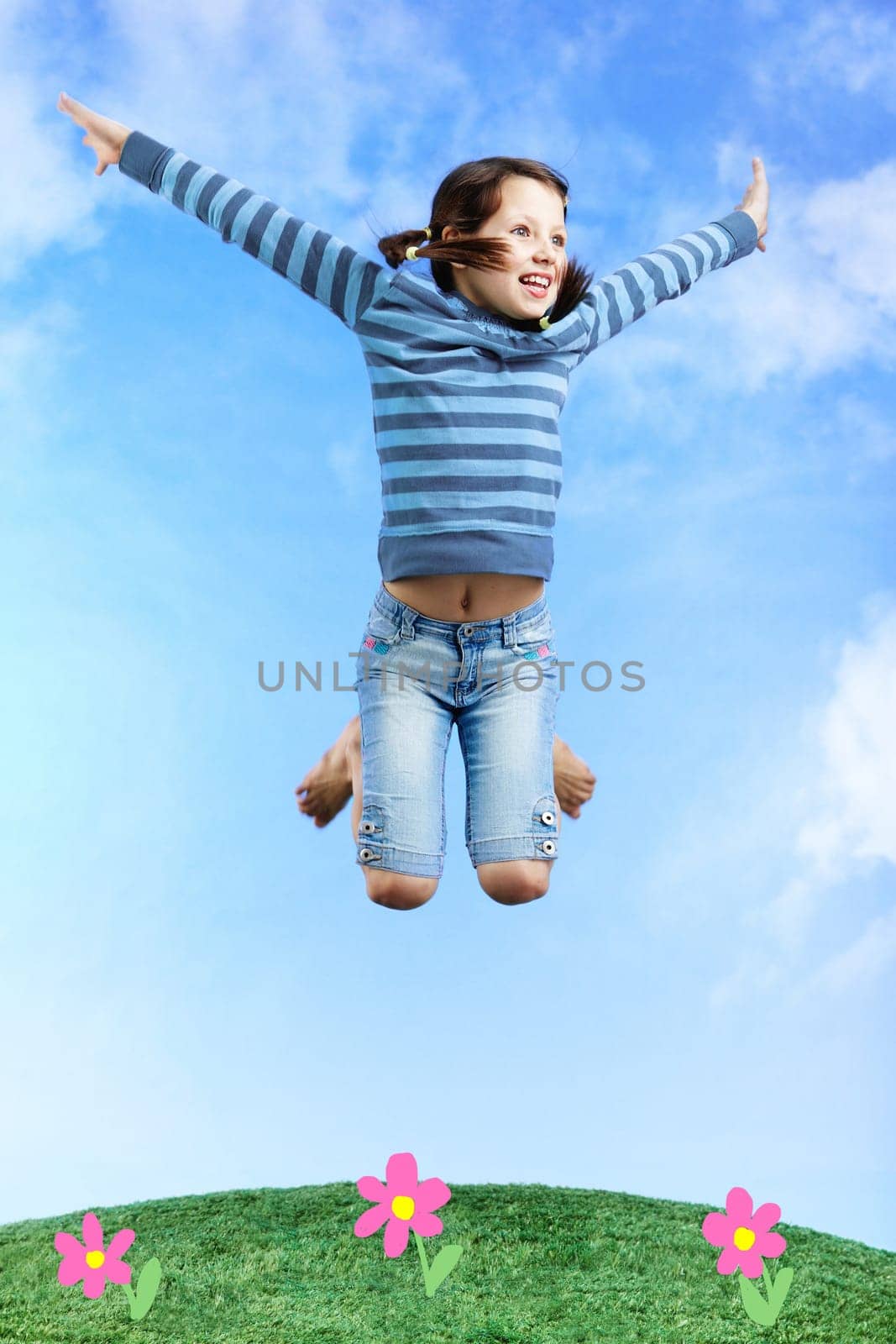 Image of happy girl jumping on the grass