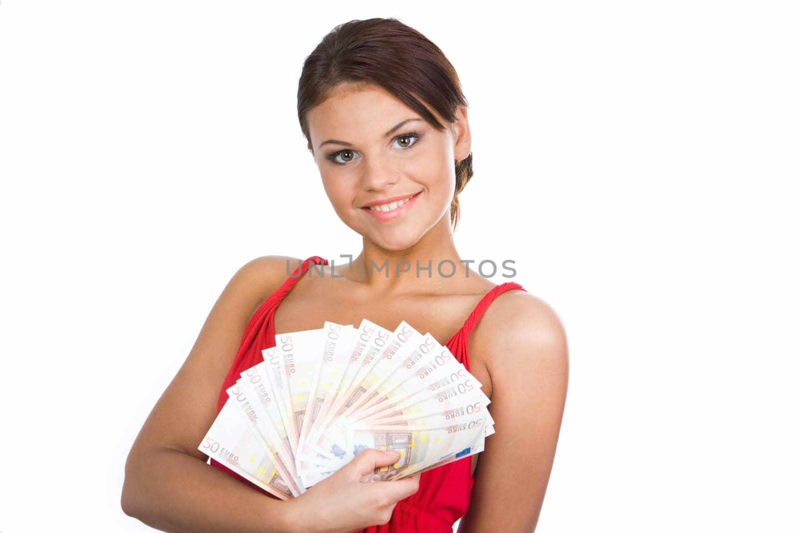 Portrait of glamorous girl holding fan of euros and looking at camera with smile