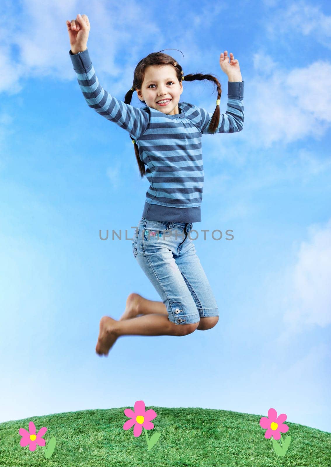 Image of happy girl jumping on the grass