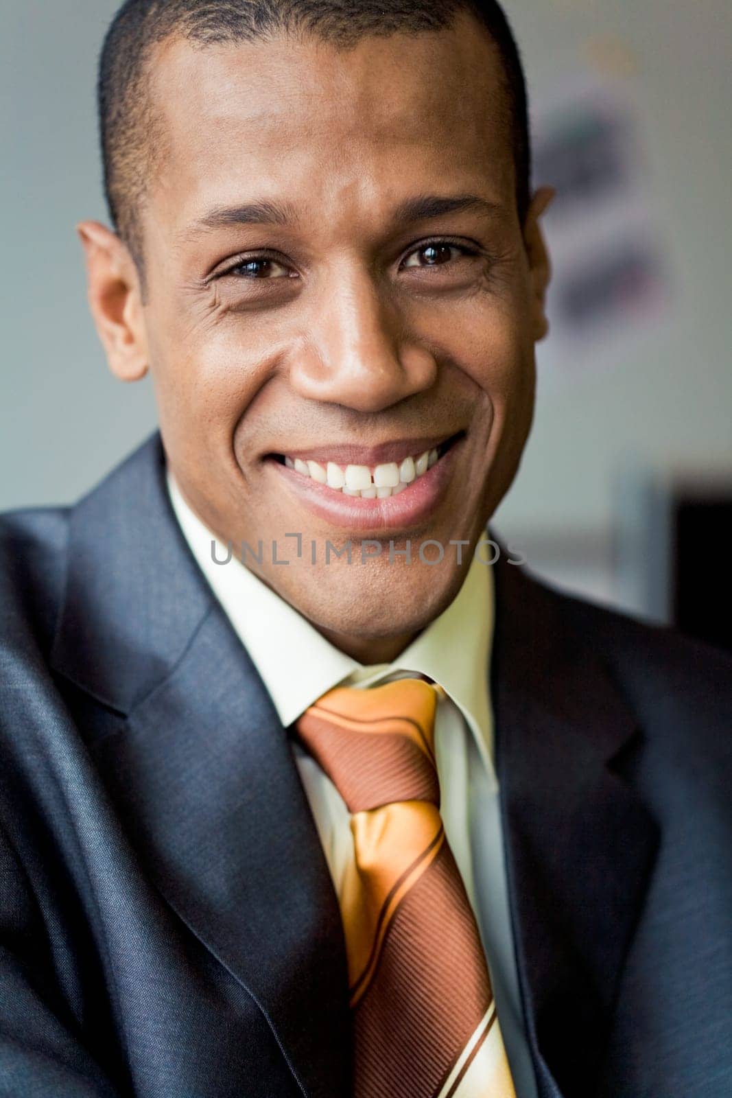 Portrait of attractive man looking at camera and smiling