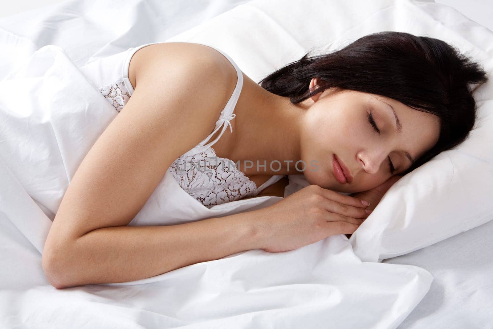 Portrait of a young girl sleeping on a pillow