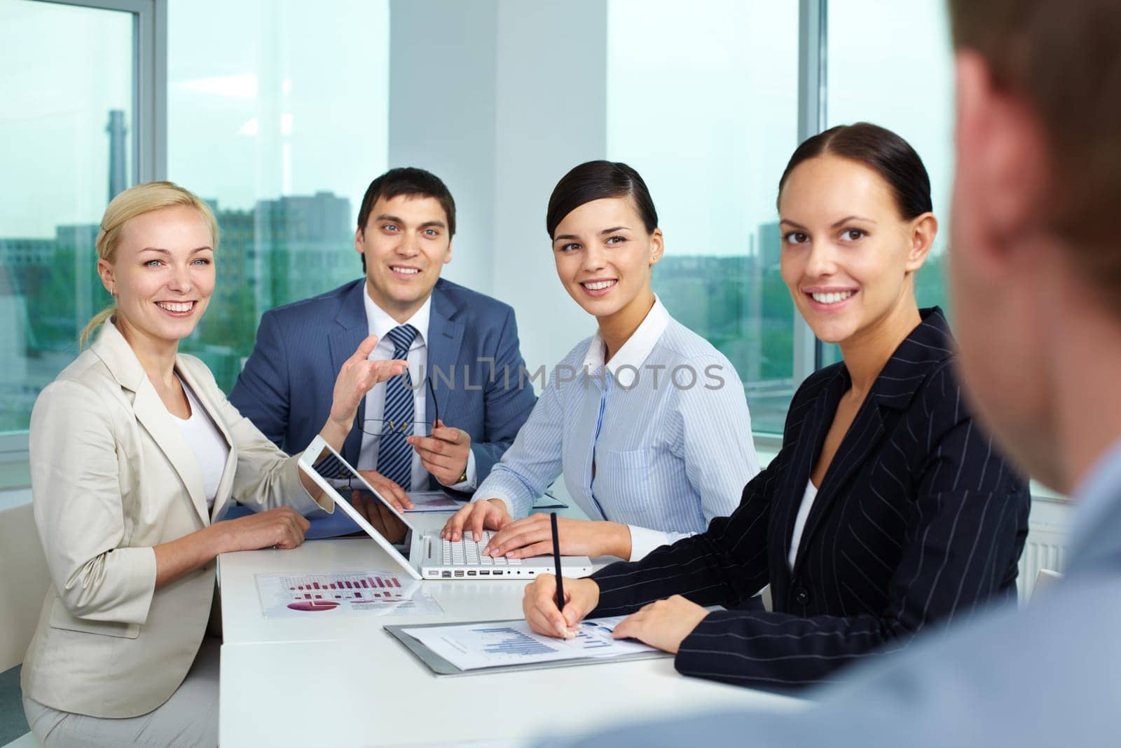 Business people sitting in boarding room and communicating