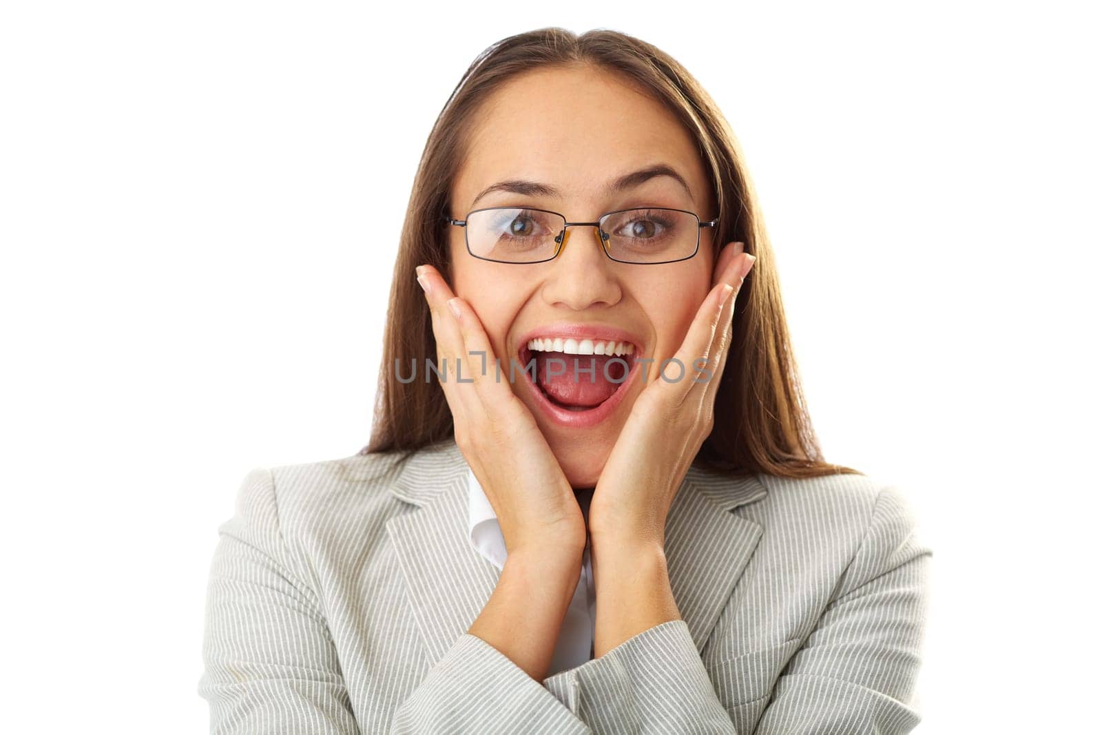 Portrait of amazed businesswoman touching her face and looking at camera