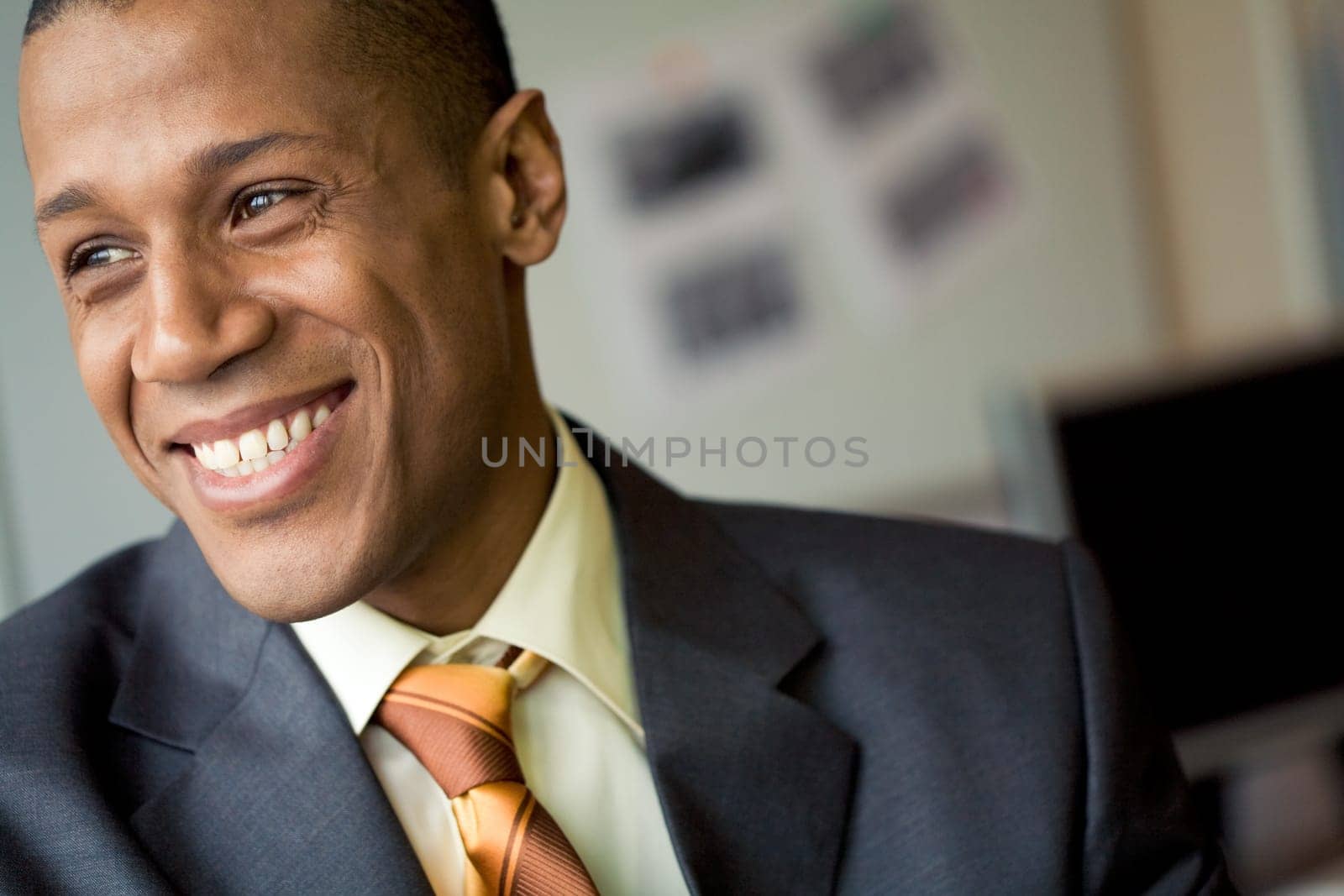 Portrait of cheerful professional looking aside and laughing