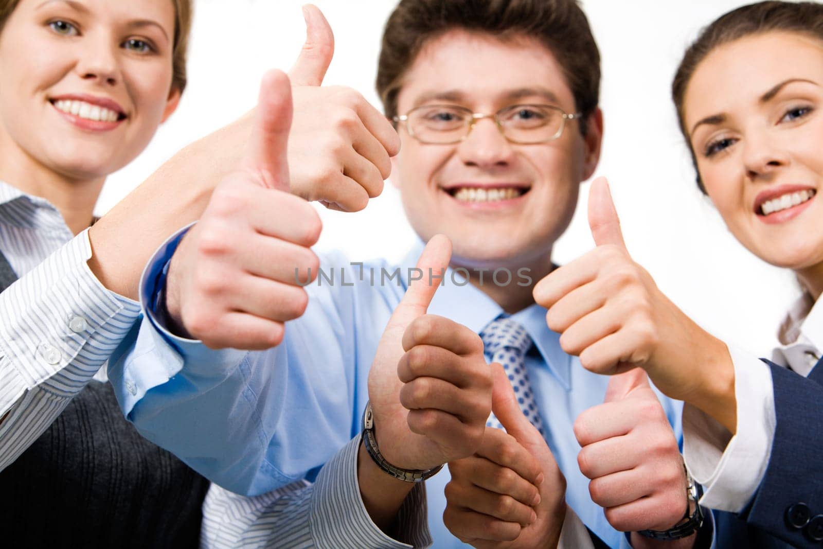 Team of three office worker's give the thumb's up sign