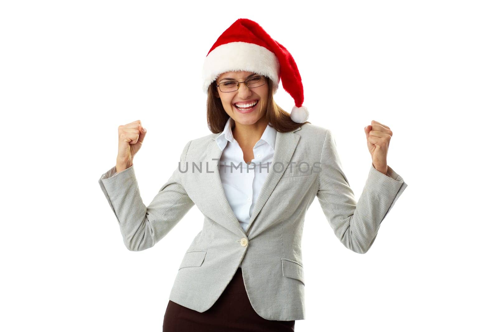 Portrait of ecstatic businesswoman in Santa cap showing her triumph