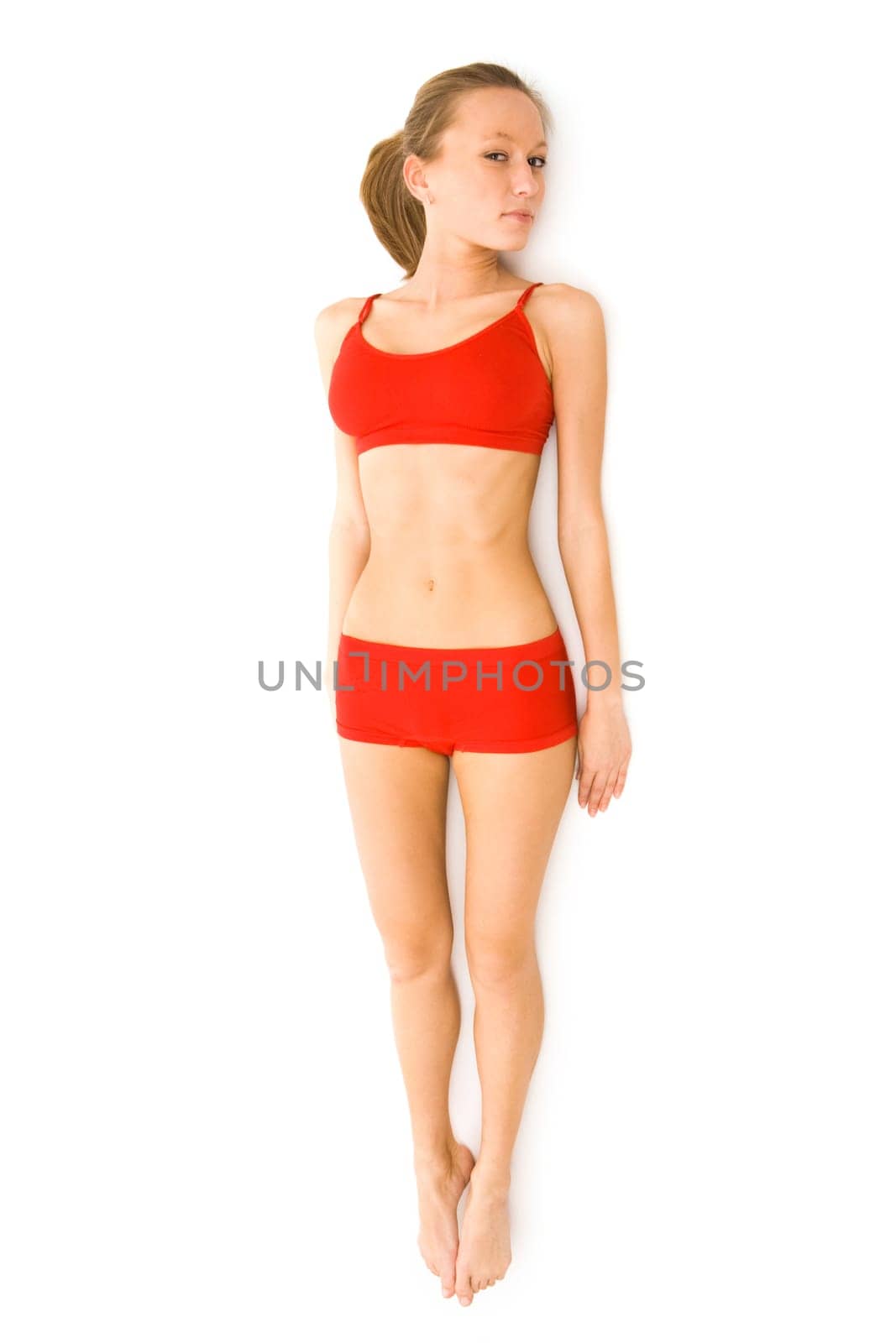 Portrait of healthy female in red underwear looking at camera