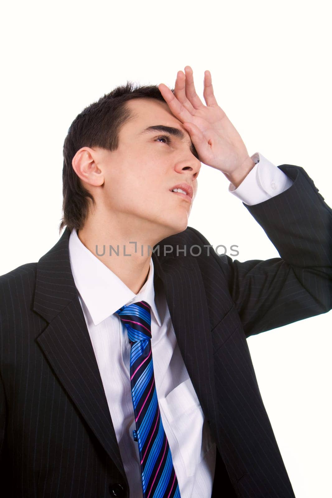 Portrait of tired man touching his head in pain on white background