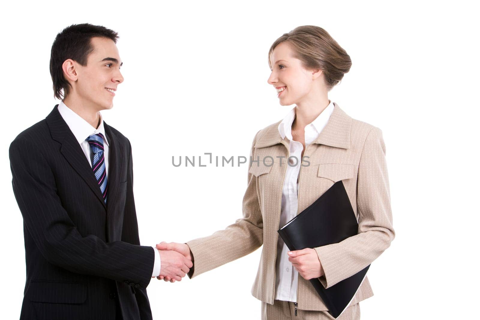 Portrait of successful business partners handshaking over white background