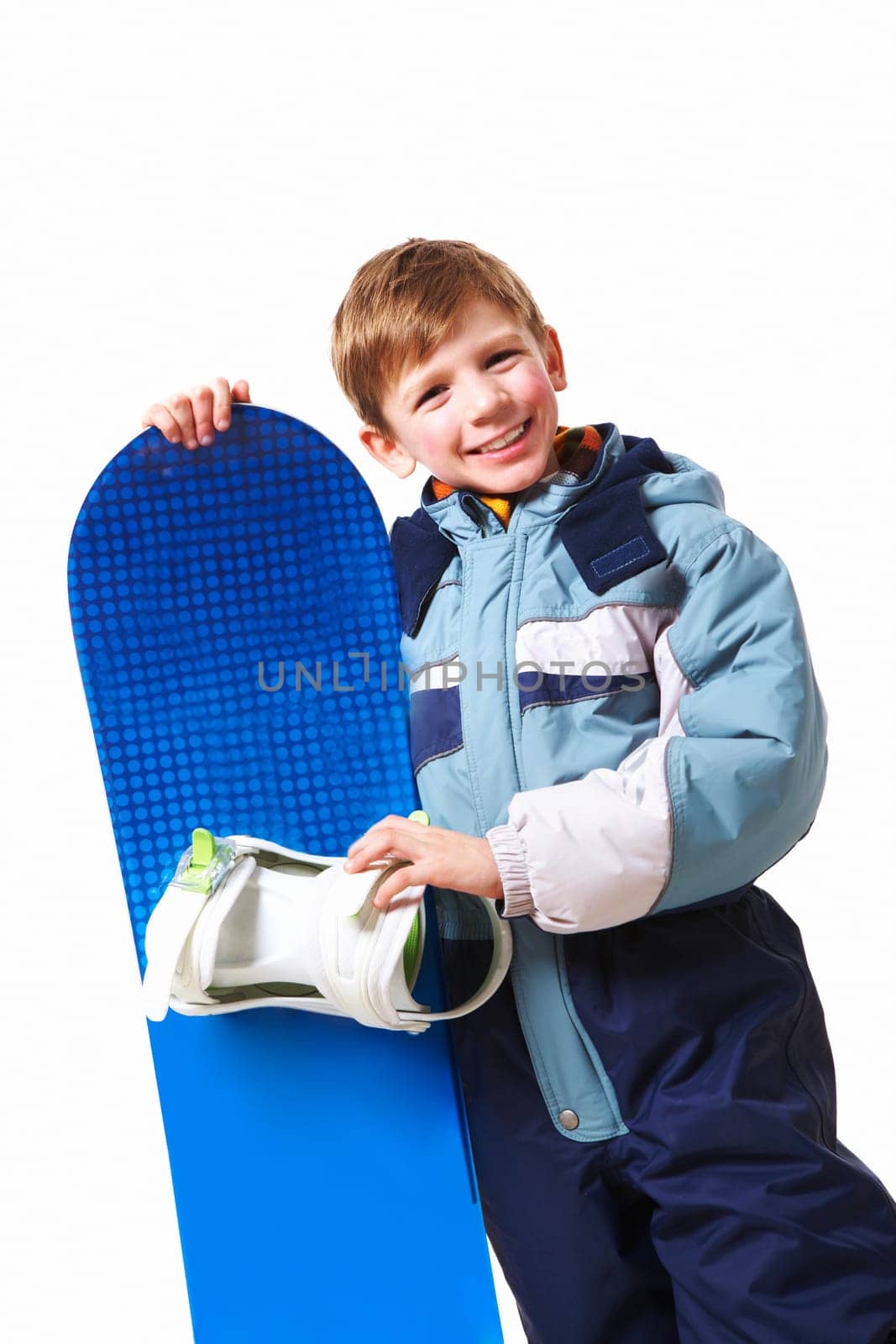 Portrait of happy boy with skateboard on white background