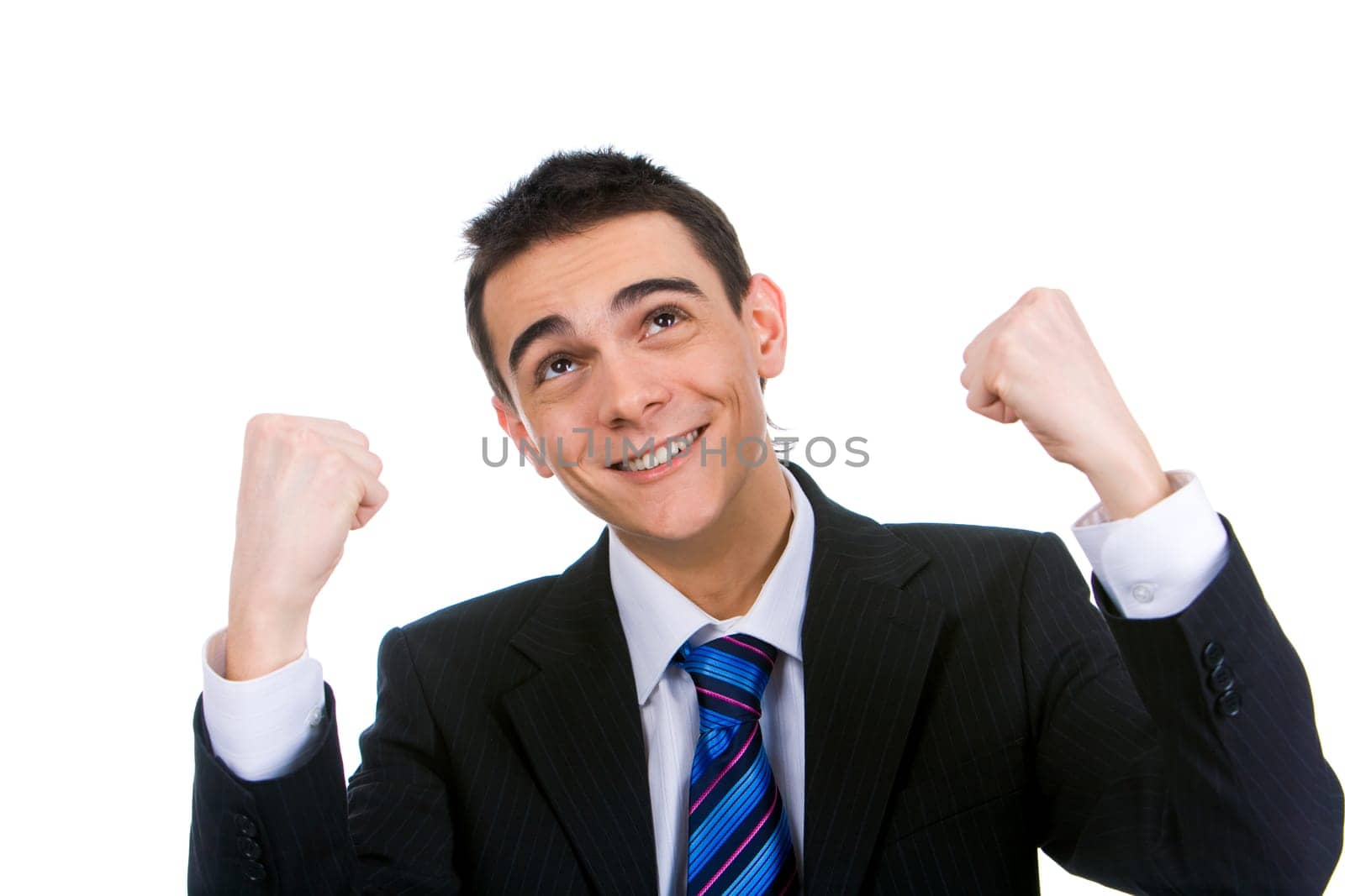 Portrait of lucky businessman looking upwards giving thanks to heaven