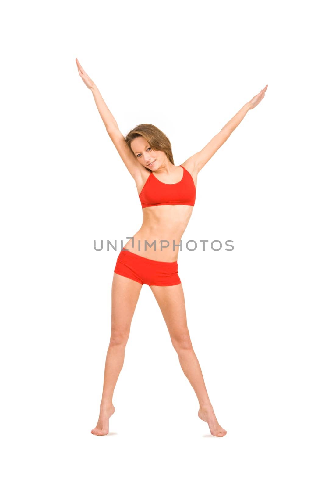 Photo of pretty woman stretching her arms upwards and looking at camera with smile
