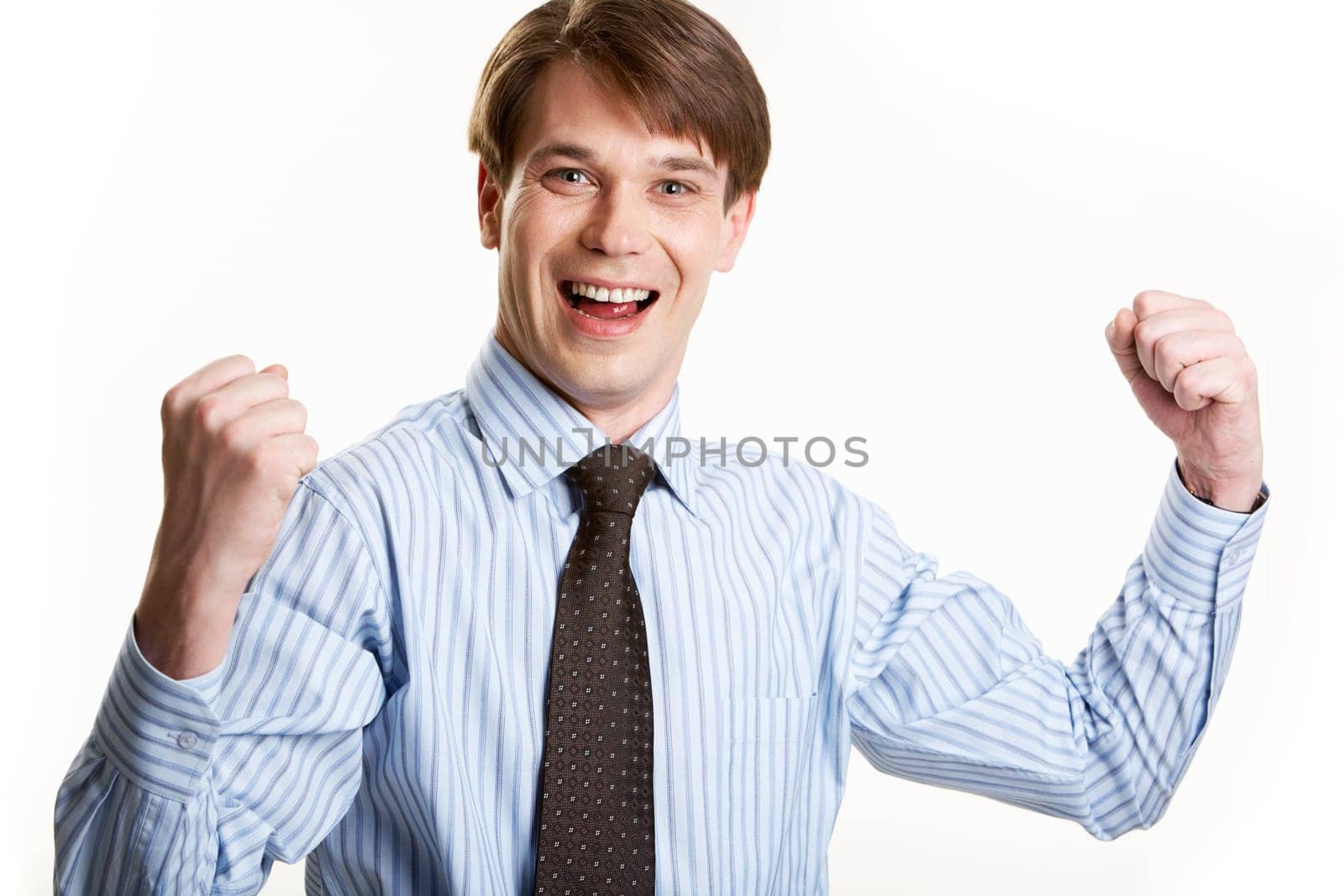 Portrait of lucky businessman looking at camera