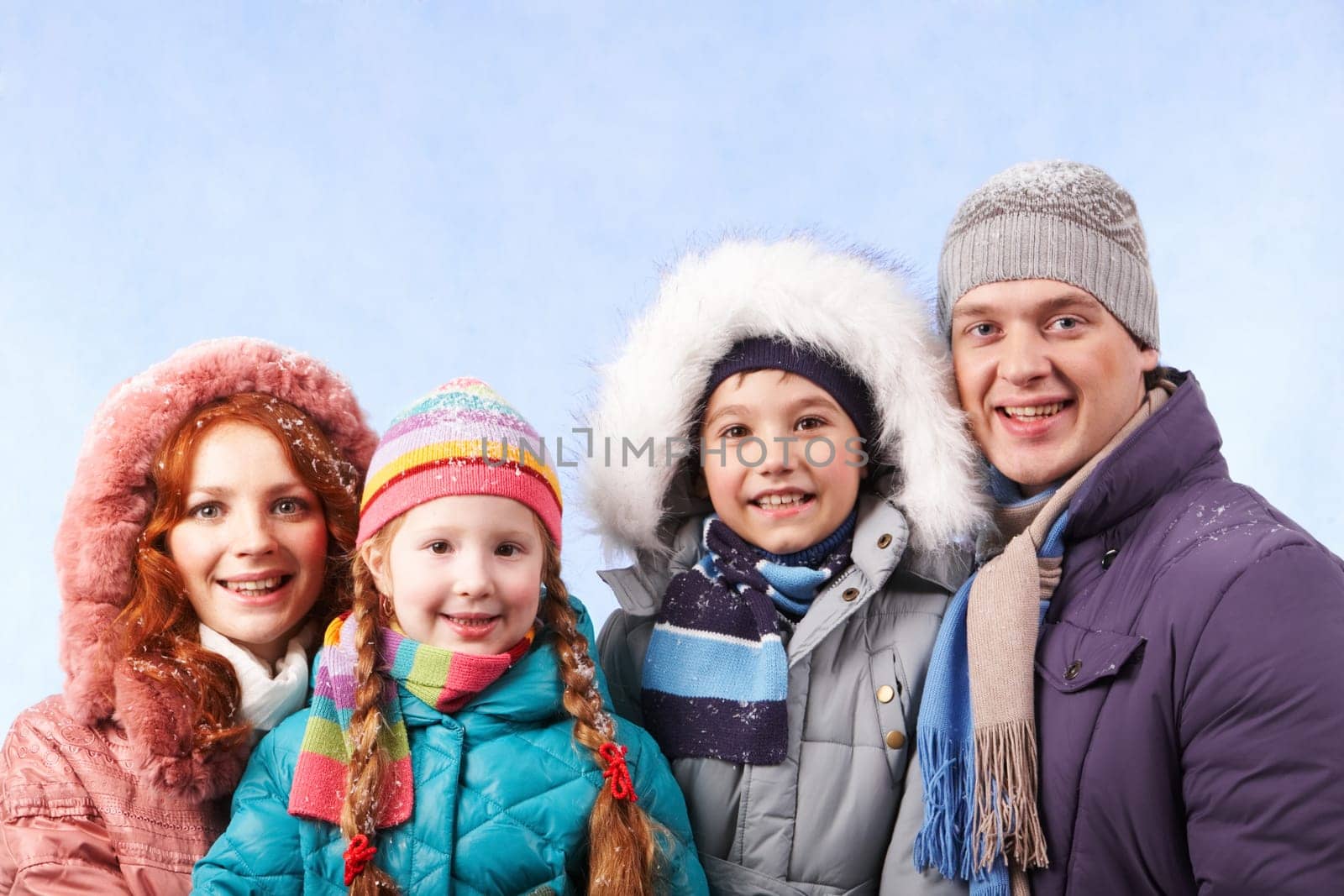 Happy family members looking at camera with smiles