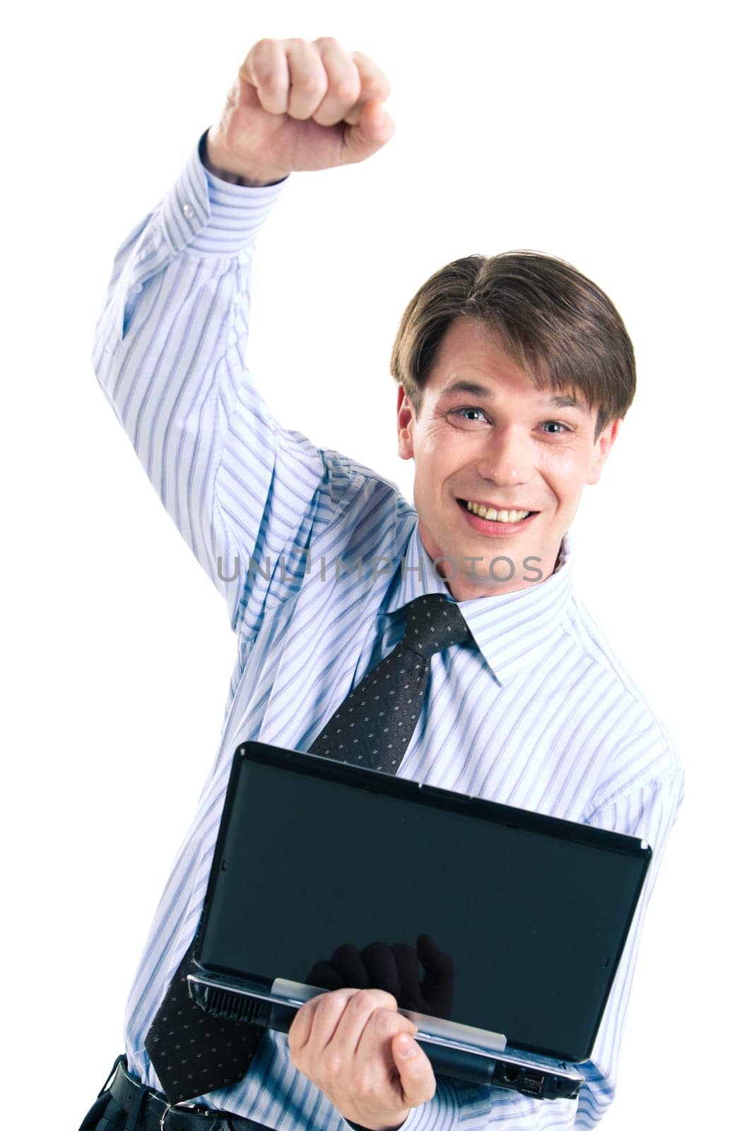 Portrait of happy man holding laptop in hands and raising his arm with smile