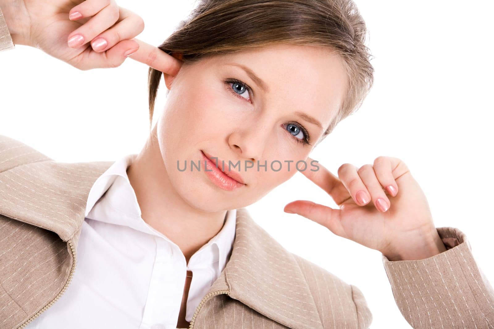 Image of pretty employee closing her ears with forefingers and looking at camerea with irritation