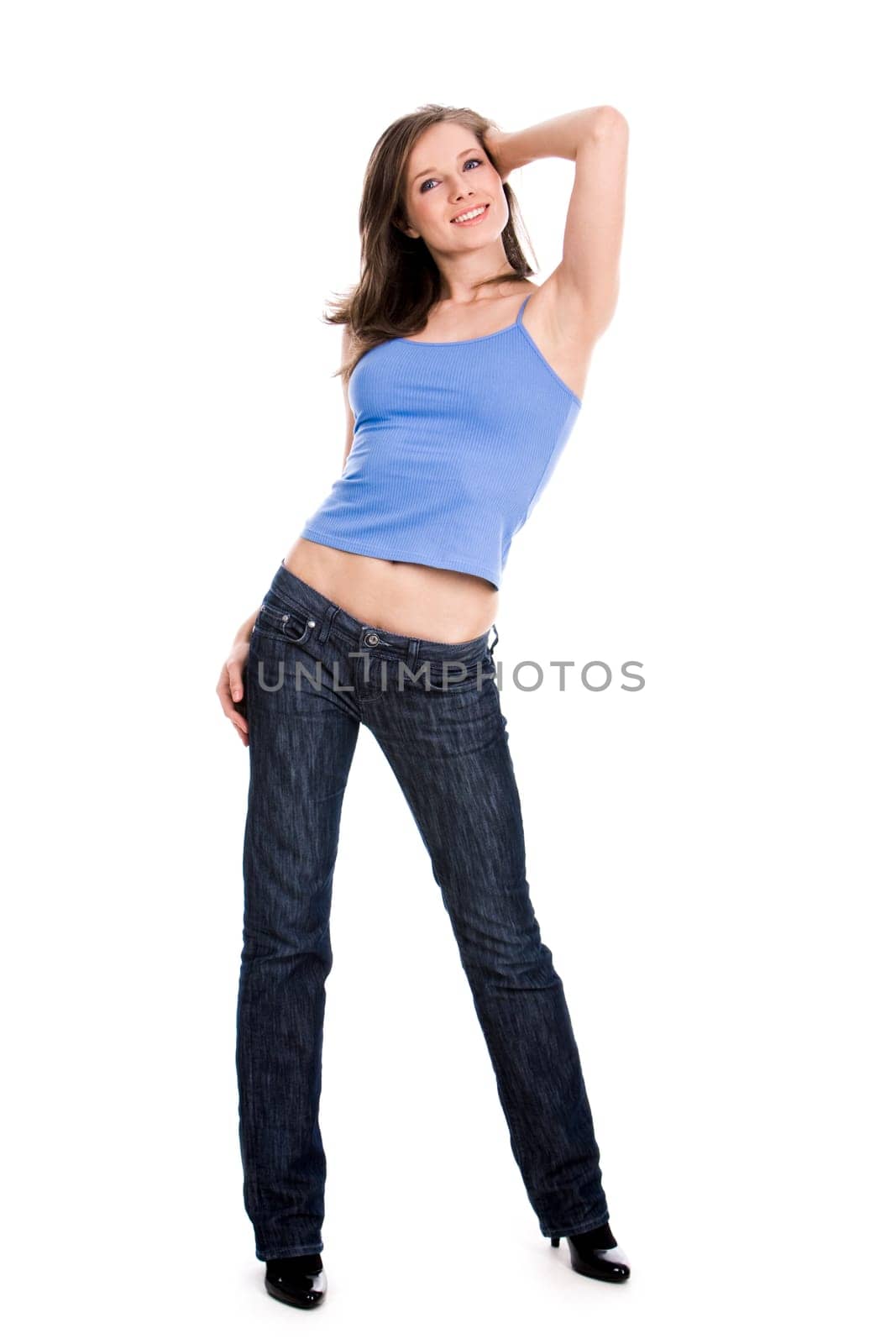 Portrait of cute girl wearing blue tanktop and jeans over white background
