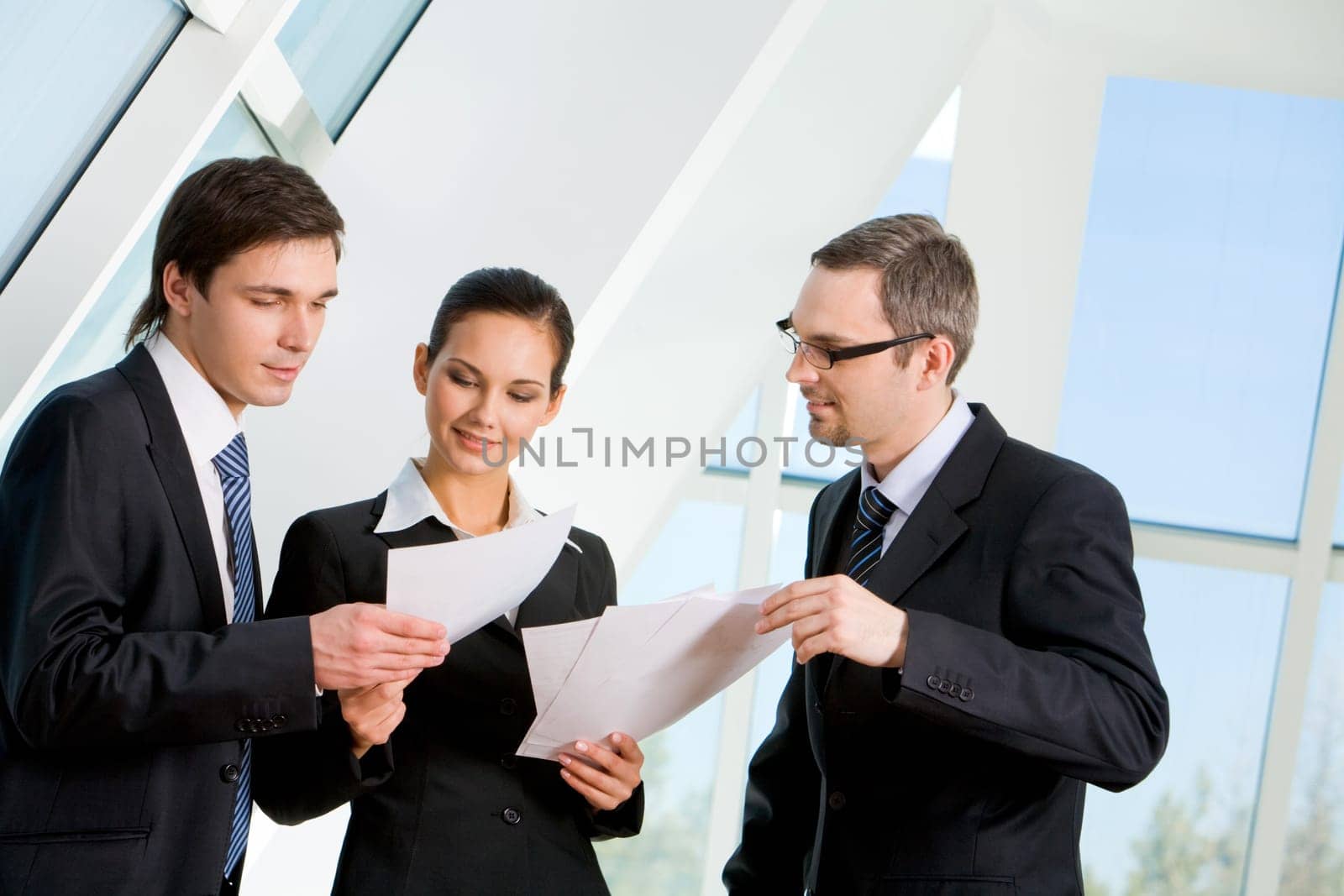 Portrait of busy people discussing new project or working plan