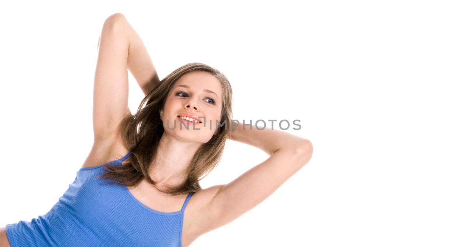 Portrait of cute girl wearing blue tanktop touching her hair over white background