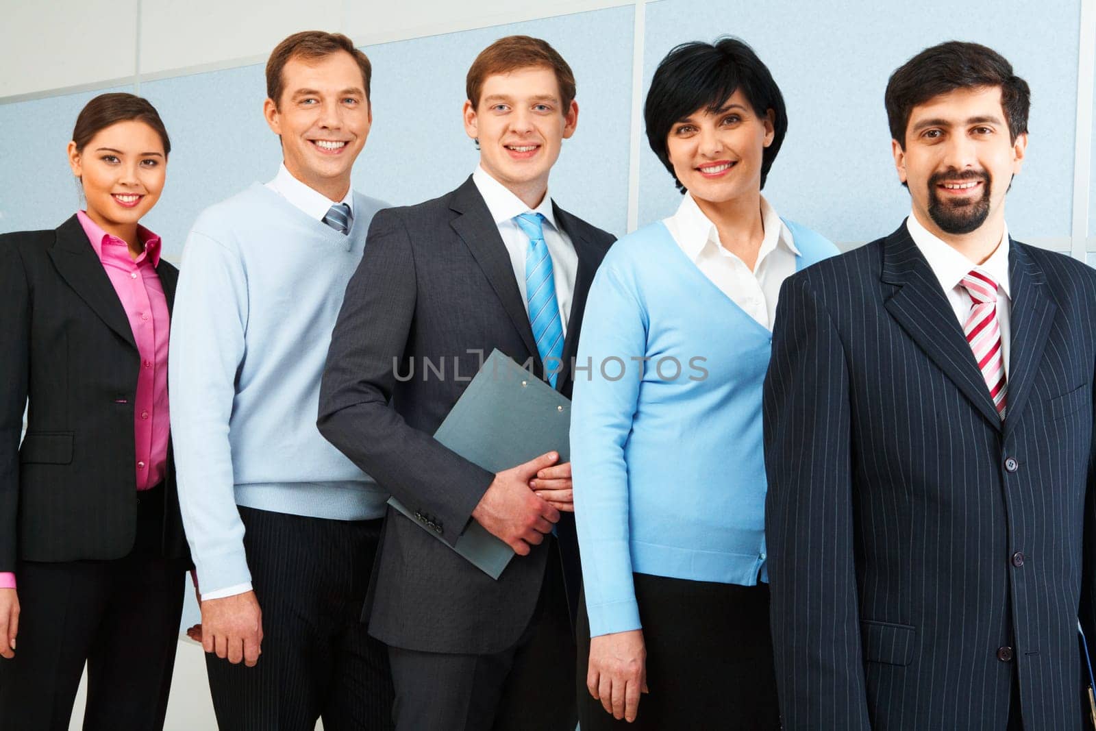 Photo of successful employees looking at camera