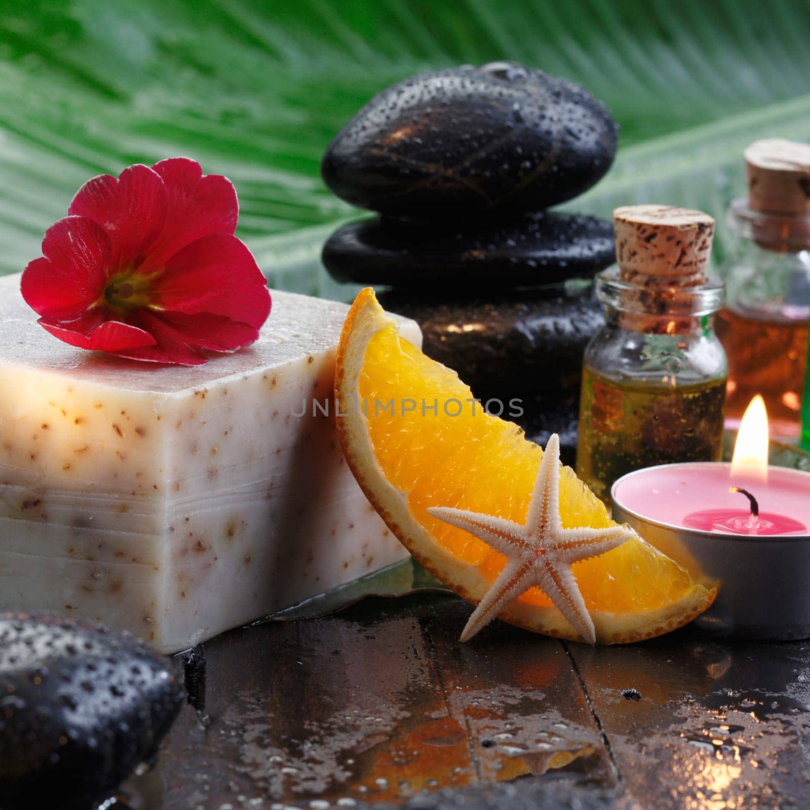 Orange Soap and hot stones for massage for aromatherapy concepts