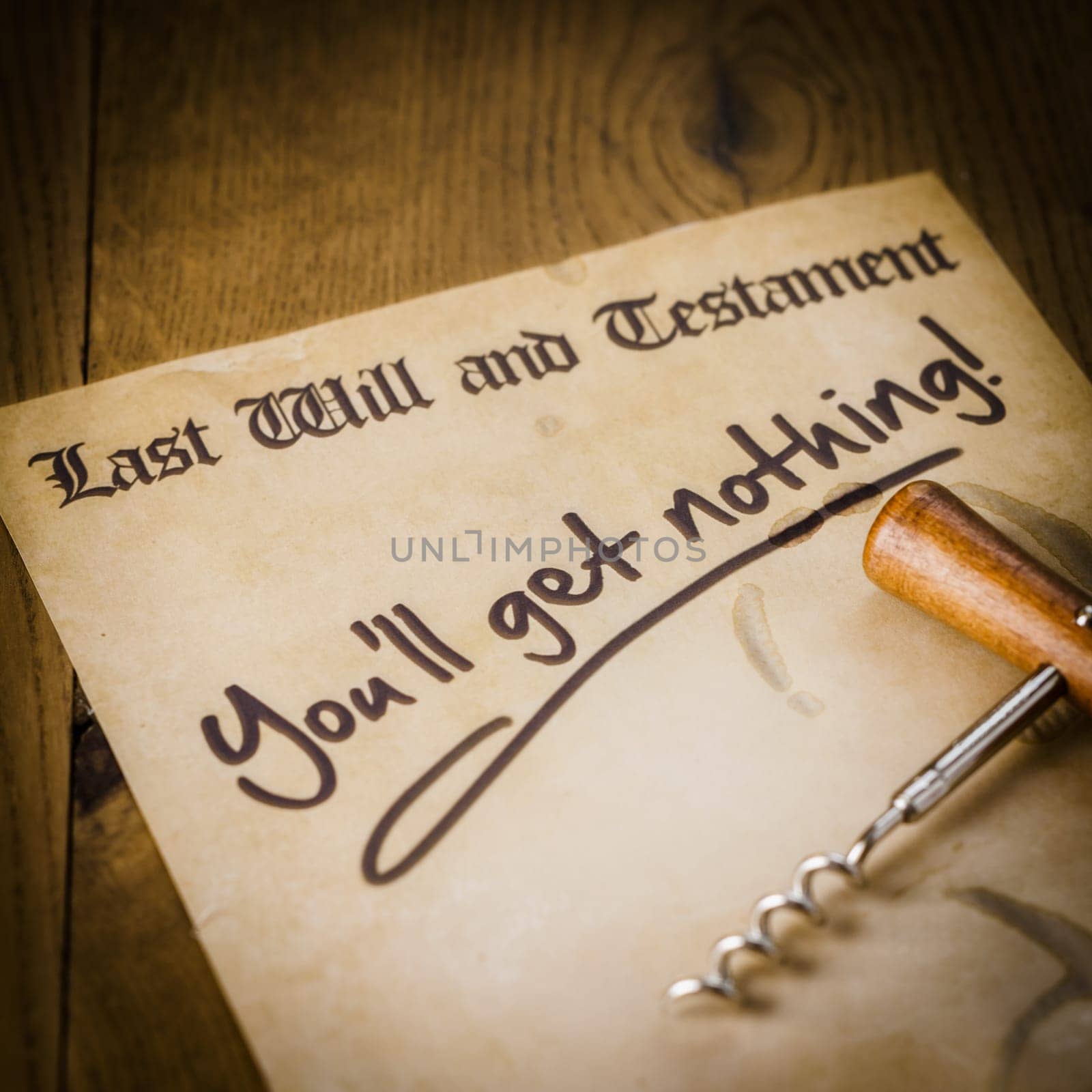 Humorous will of an alcoholic or spendthrift playboy with a corkscrew and scrawled message You'll get nothing