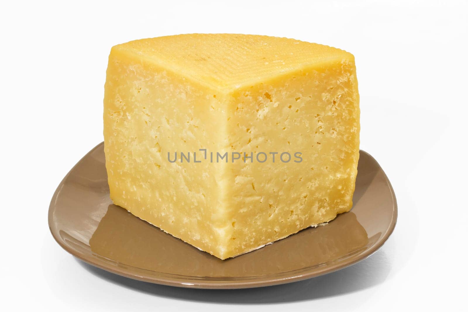 manchego cheese, typical of Spain, isolated on a white background