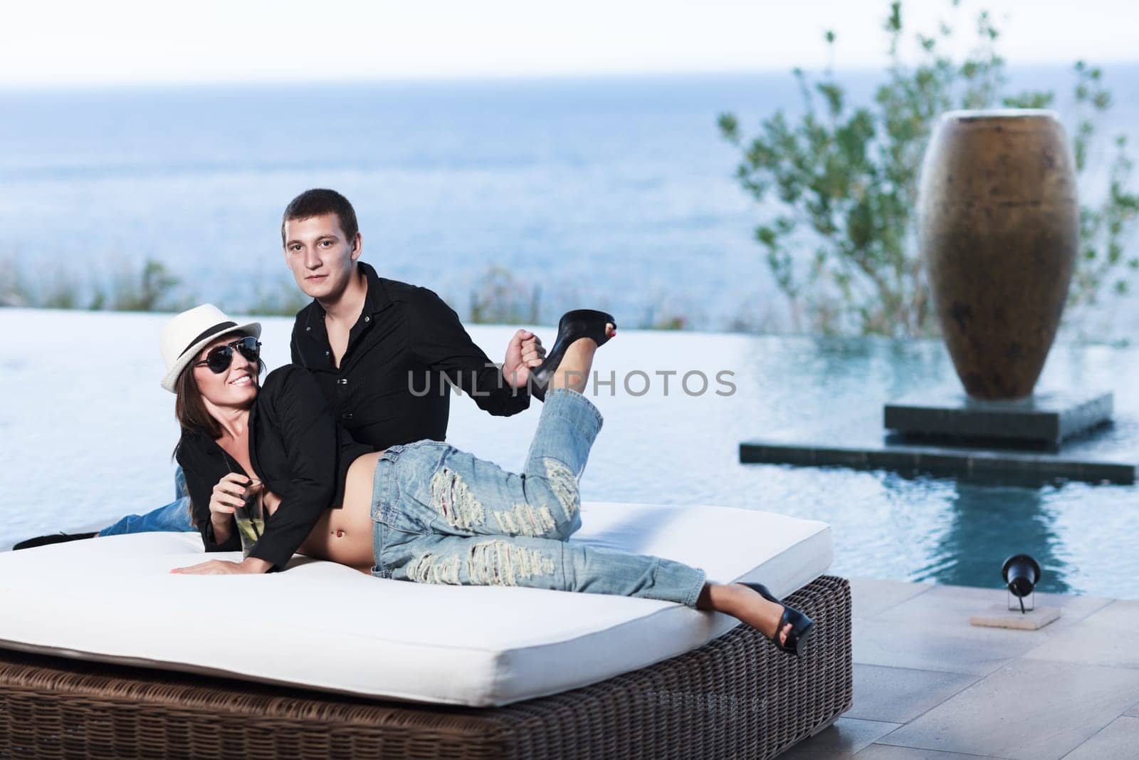Young couple. Sea on the background