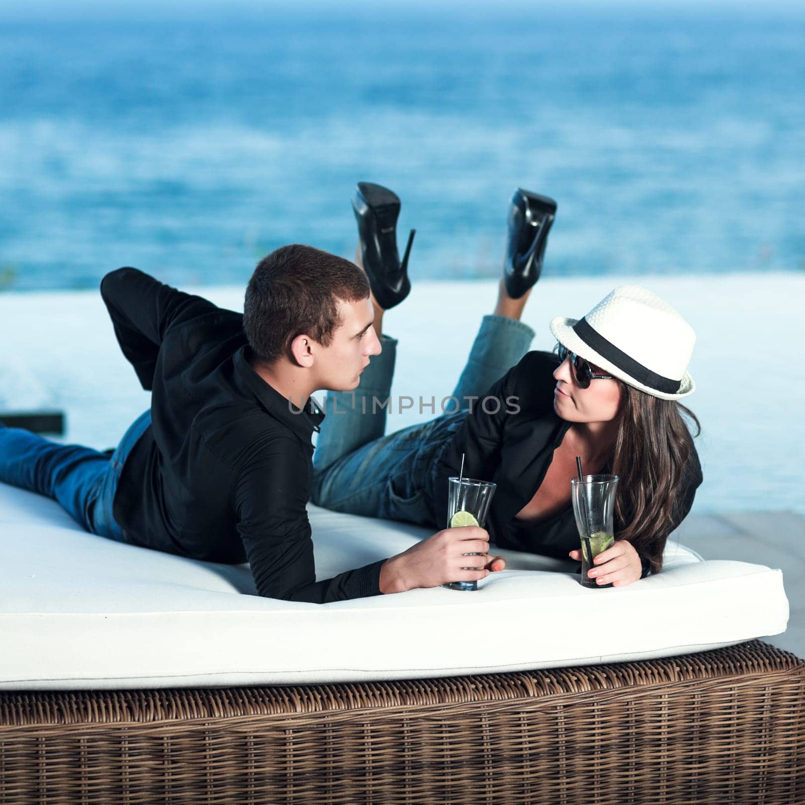 Young couple. Sea on the background