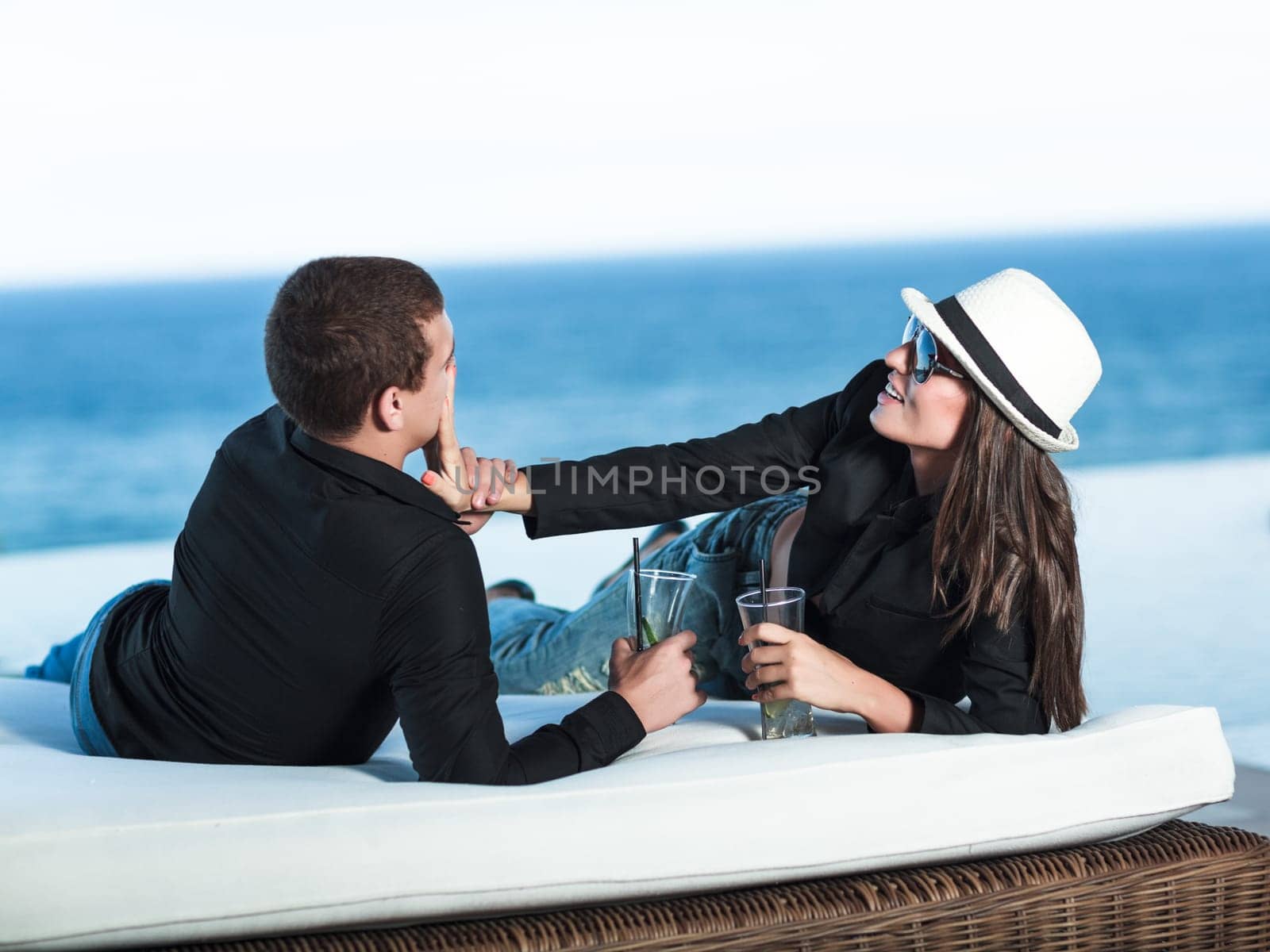 Young couple. Sea on the background