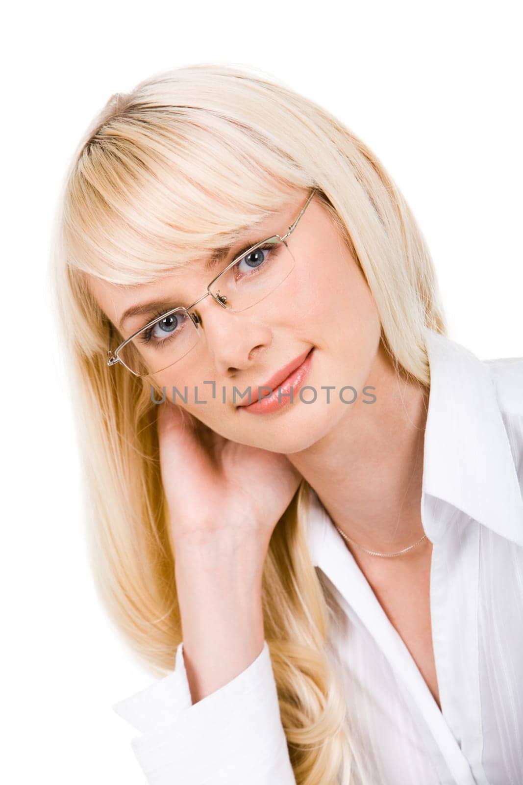 Portrait of charming lady in glasses touching her hair and looking at camera